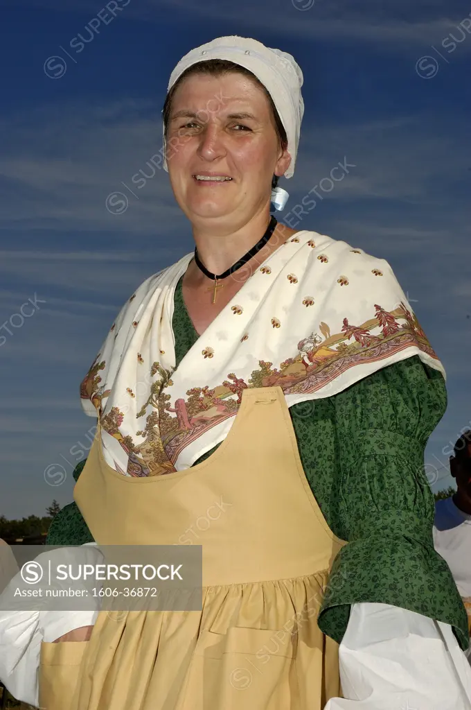 Fete de la batteuse (threshing machine celebration), portrait smiling woman with traditionnal costum