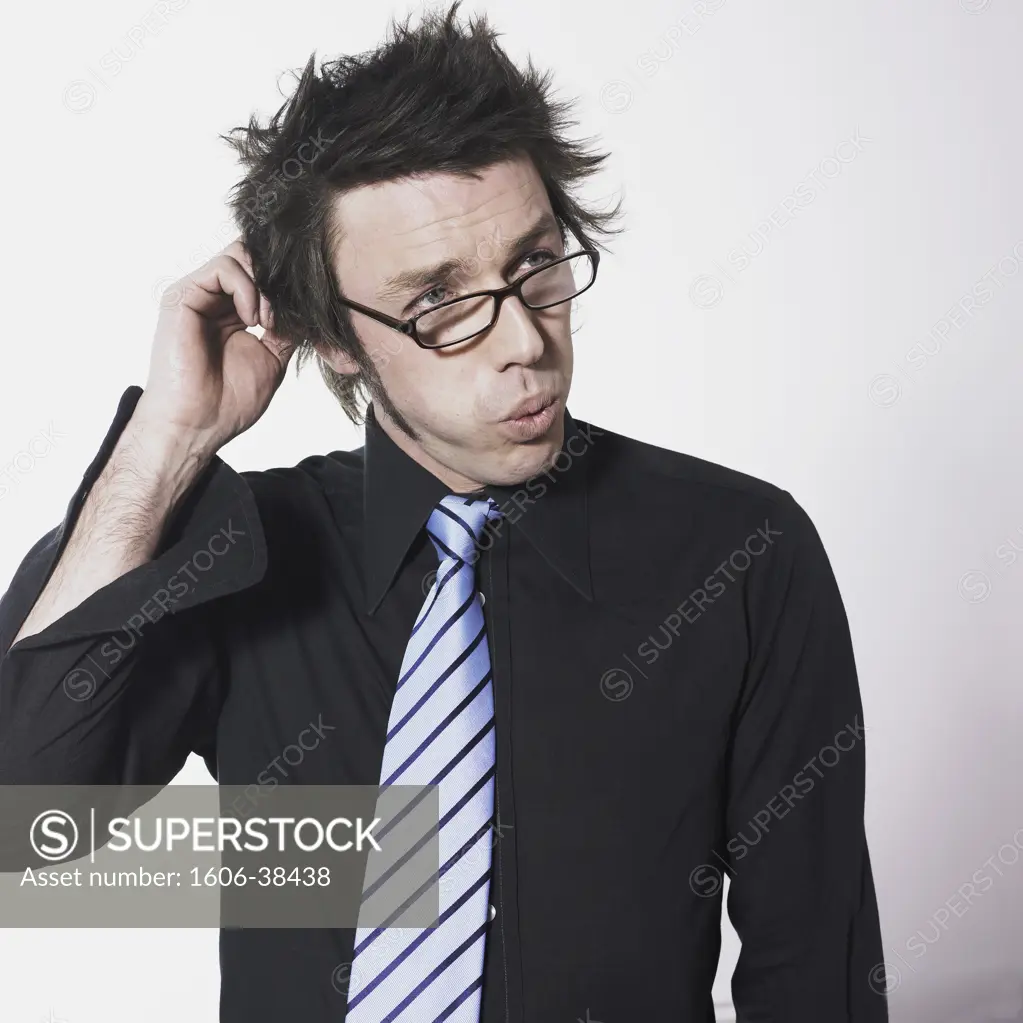 Portrait man, black shirt, striped tie, glasses, thinking, scratching his head, white background
