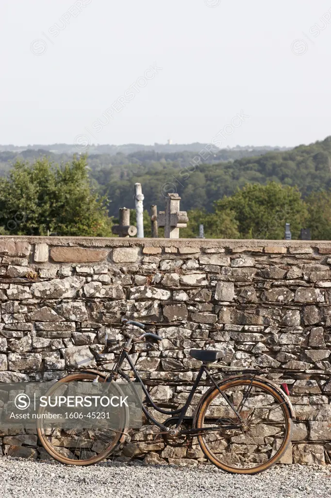 France, Brittany, Ille et Vilaine, Pléchatel, bike against cemetery wall