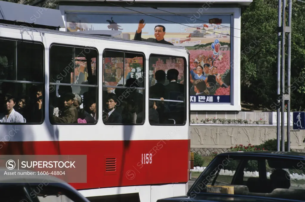 North Korea, Pyongyang, tramway (street car) and passengers, portrait of the great leader Kim Il Sung