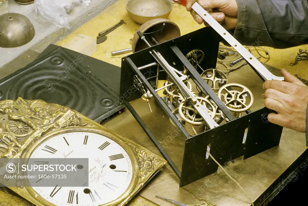 France, Franche Comte, Doubs, traditionnal clock "Comtoise" workshop, indoors