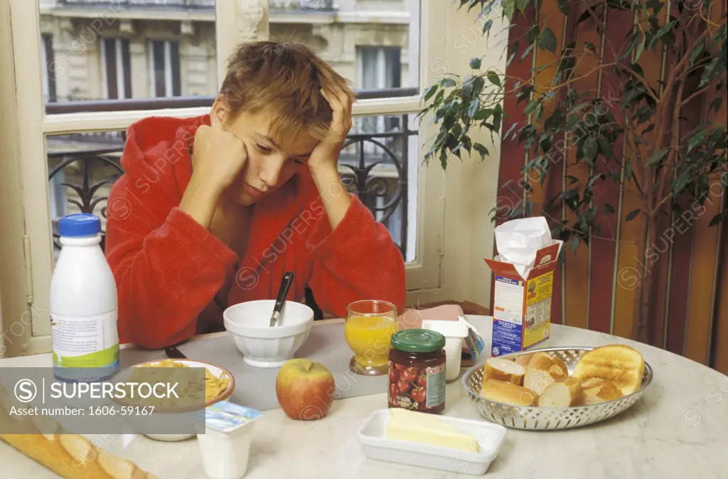 Teen boy having breakfast
