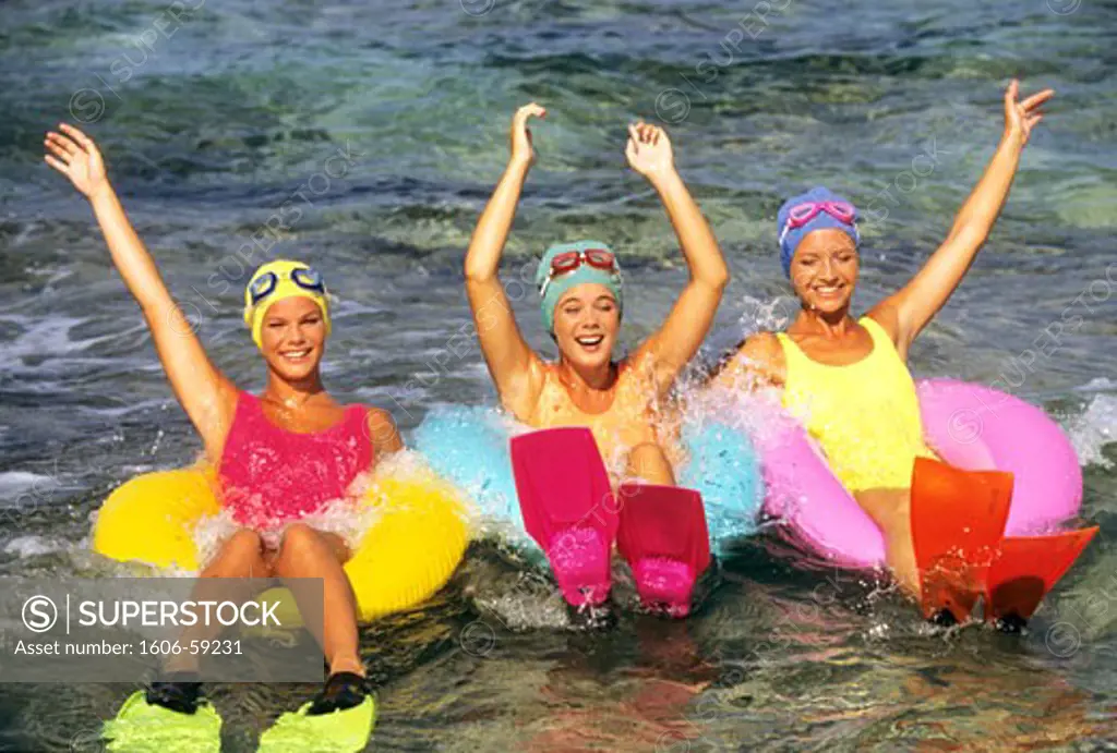 3 women having fun in the sea
