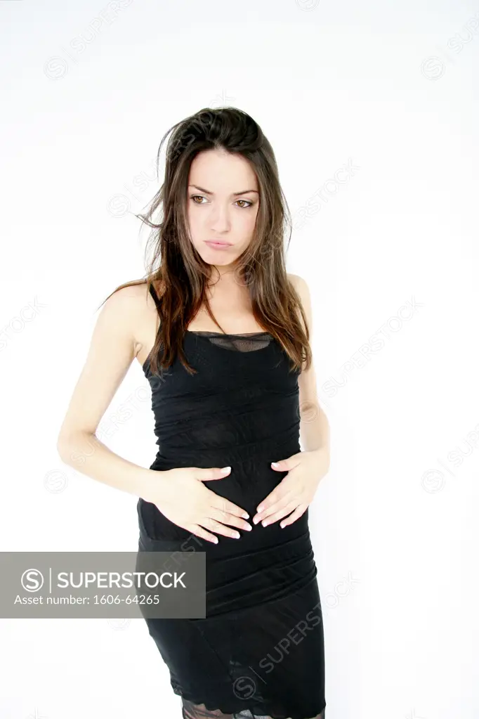 Woman standing with hands on her belly