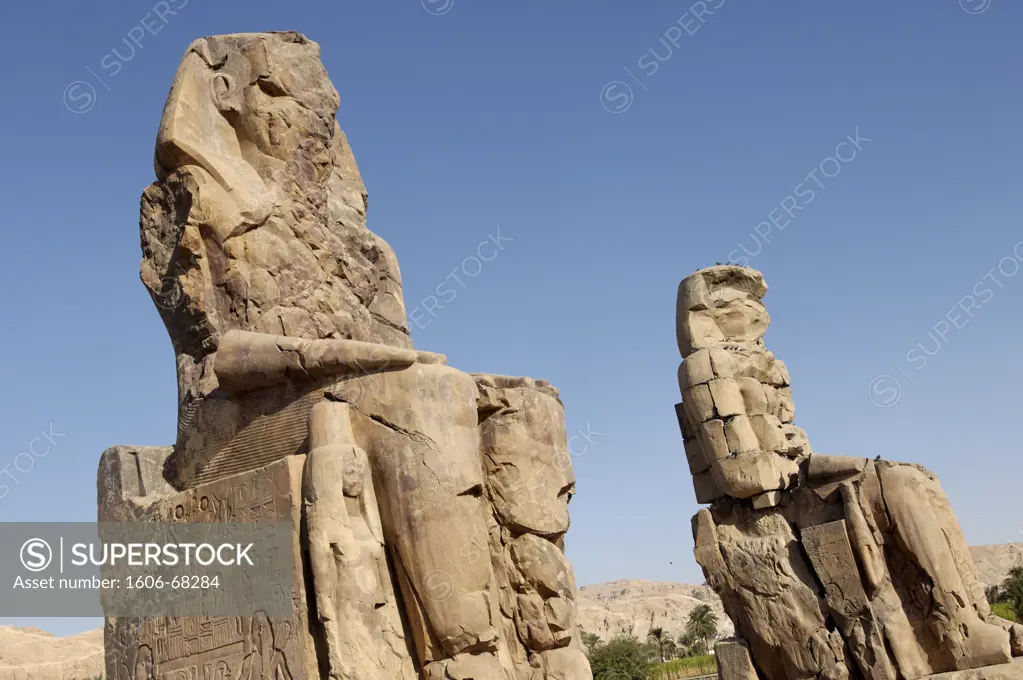 The Colossi of Memnon are two massive stone statues of Pharaoh Amenhotep III. For the past 3400 years they have stood in the Theban necropolis, across the River Nile from the modern city of Luxor.The twin statues depict Amenhotep III (14th century BC)
