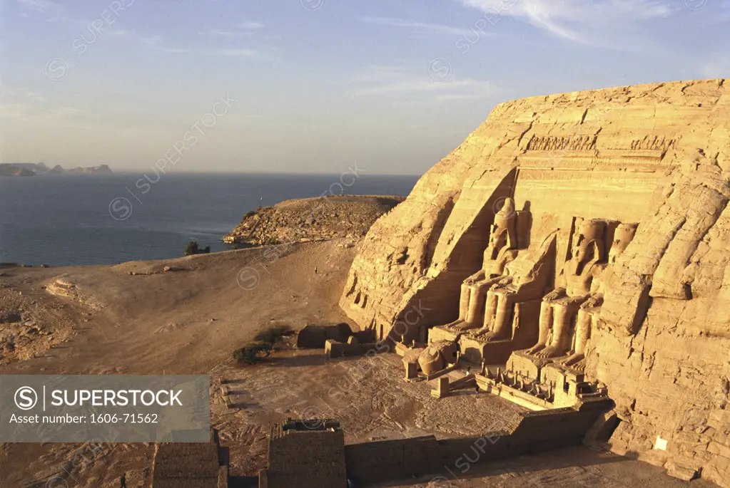 Egypt, Abu-Simbel, elevated view  of Ramses II temple, Nasser's Lake in the background, sunrise