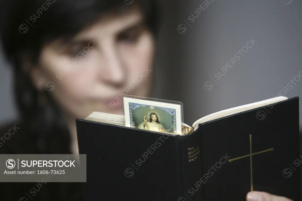 France, Paris, Woman reading the Bible