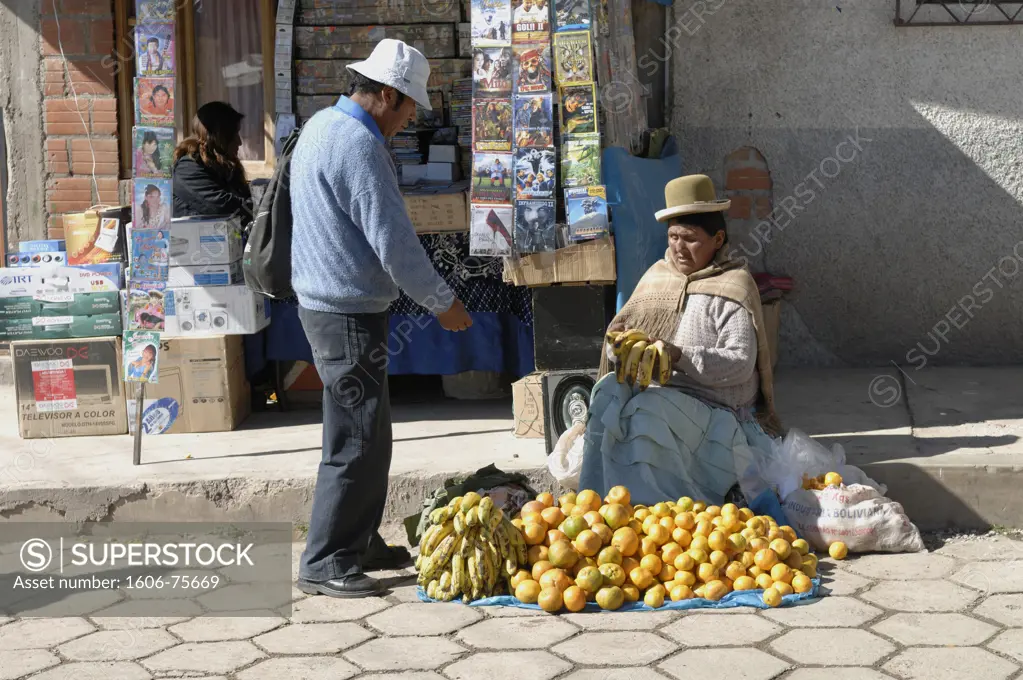 Bolivia, Titicaca lake,  Copacabana, woman selling fruits