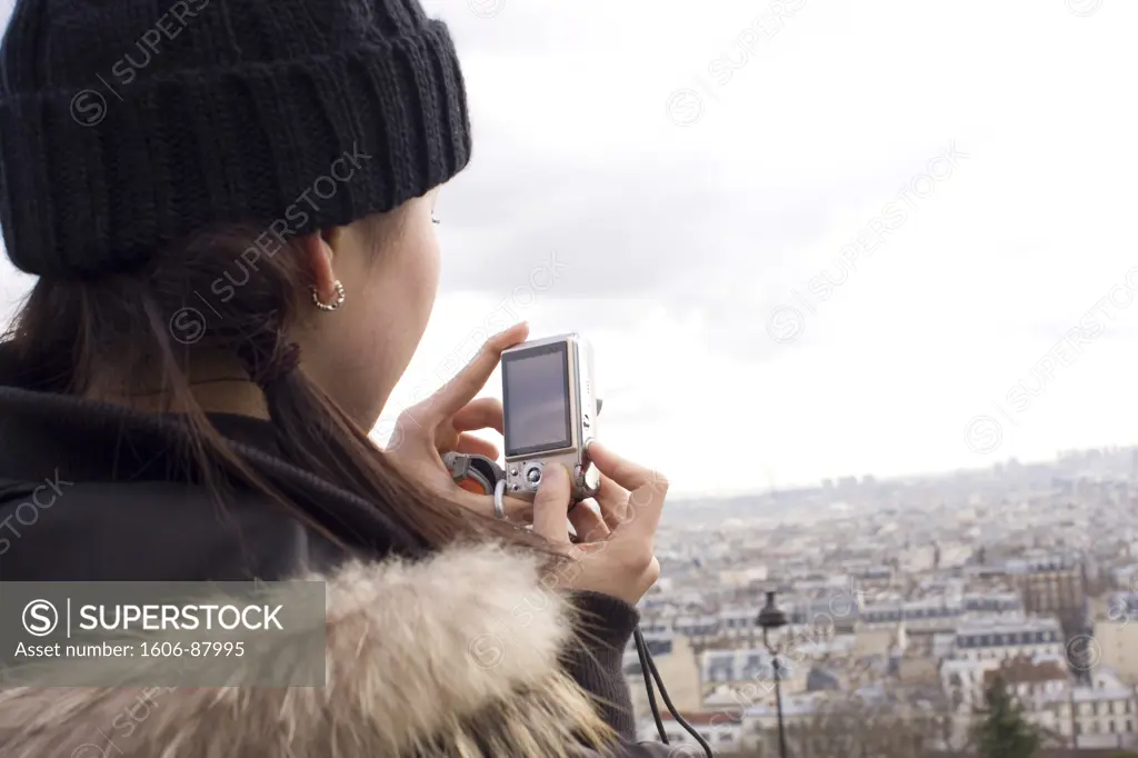 France, Paris, Montmartre, woman photographing city