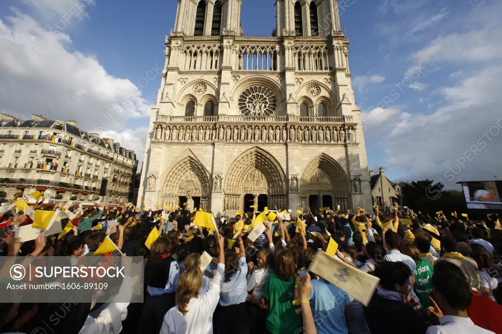 France, Paris, Crowd cheering Pope Benedict XVI outside Notre Dame cathedral