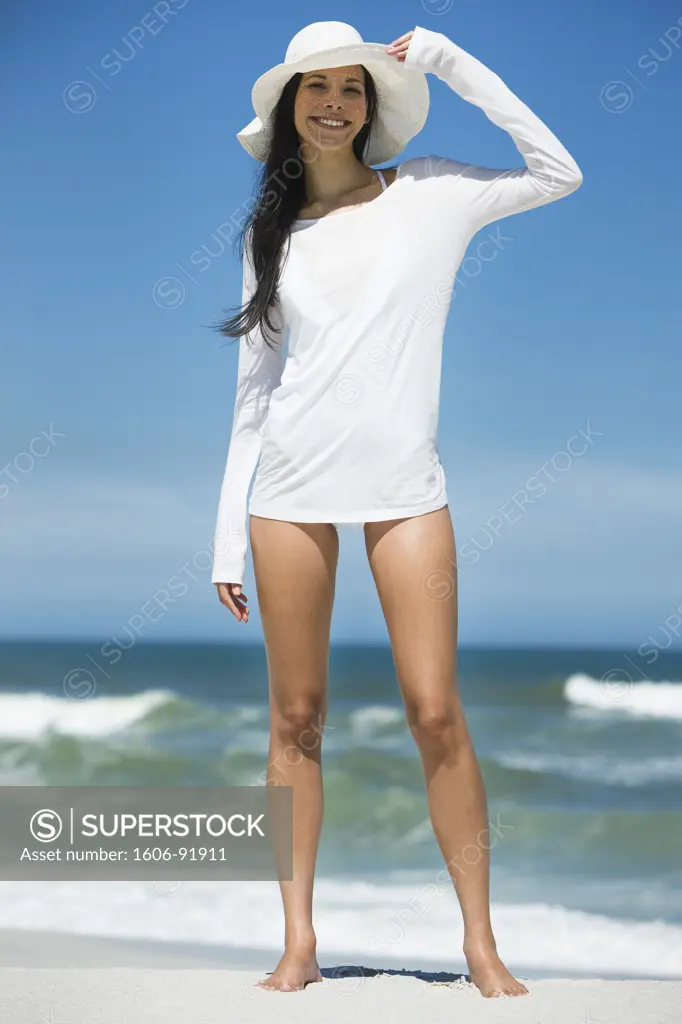 Young woman standing on the beach