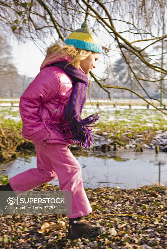 Little girl in park in winter