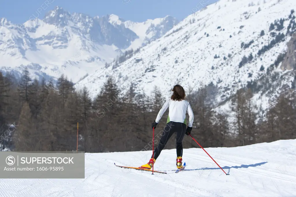France, Alps, Hautes Alpes, woman, cross-country skiing