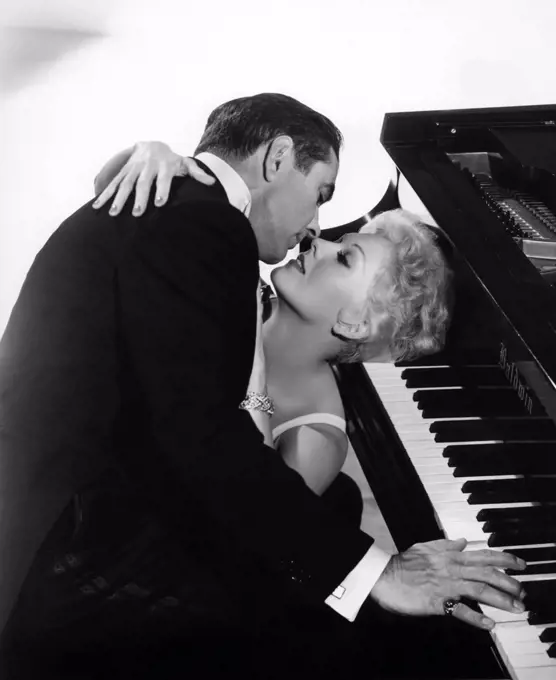 Tyrone Power and Kim Novak , The Eddy Duchin Story , 1956 directed by George Sidney  Columbia Pictures