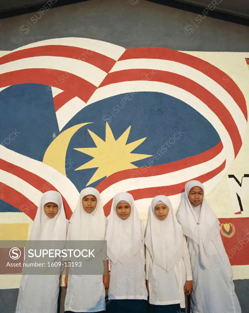 Muslim School Girls in front of Malaysian Flag Mural, Kota Bharu, Kelantan, Malaysia
