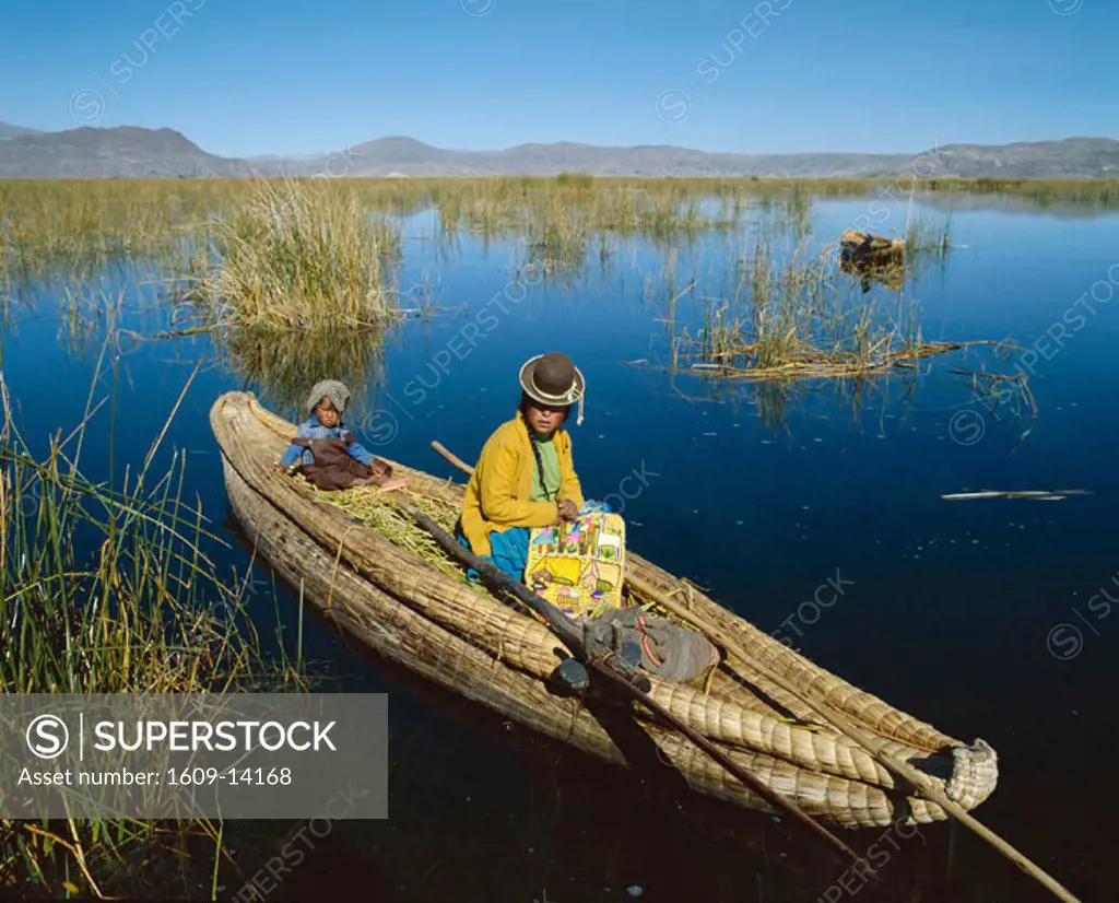 Lake Titicaca / Uros Indian Woman and Child Sitting in Traditional Reed Boat, Peru