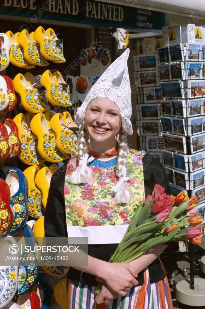 Souvenir Store Selling Clogs & Postcards / Girl Dressed in Dutch Costume Holding Tulips, Amsterdam, Holland (Netherlands)