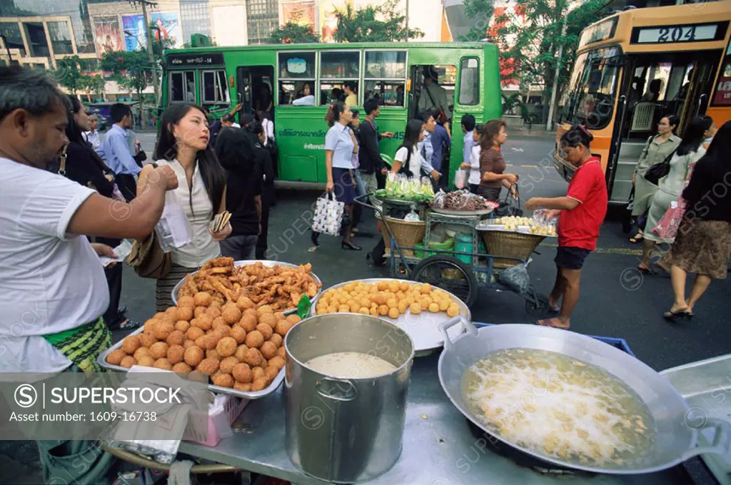 Thailand, Bangkok, Typical Street Scene with Buses, People and Food Stalls