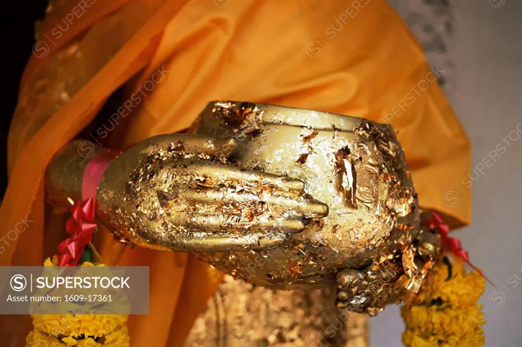 Thailand, Nakhon Pathom, Nakhon Pathom Chedi, Gold Leaf Covered Hand and Alms Bowl Detail of Buddha Statue