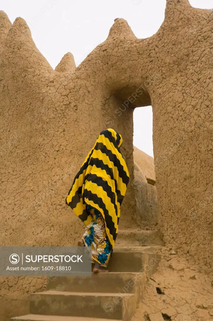 Woman outside Mud Mosque in Segoukoro, Segou, Mali