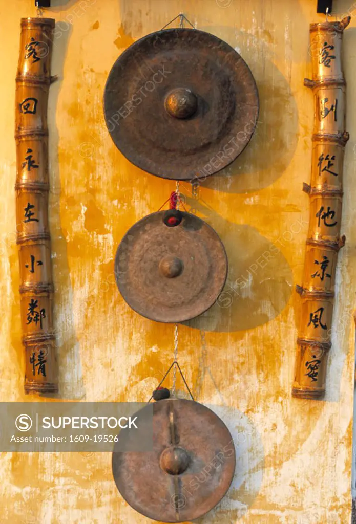 Gongs hanging on a wall, Vietnam