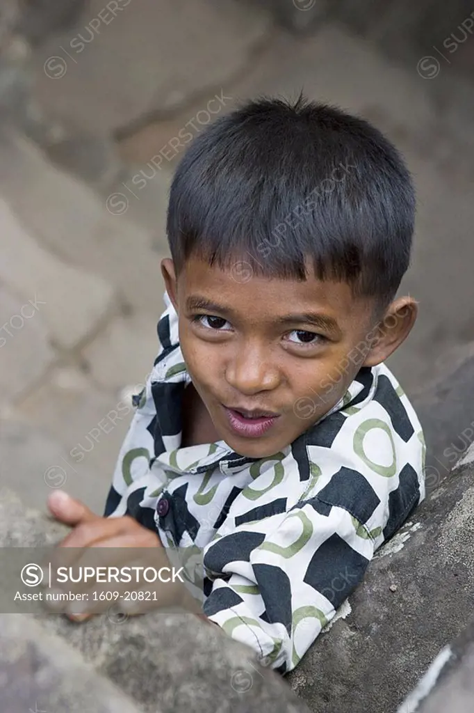 Young cambodian boy at Bayon Temple, Angkor Thom, Siem Reap, Cambodia