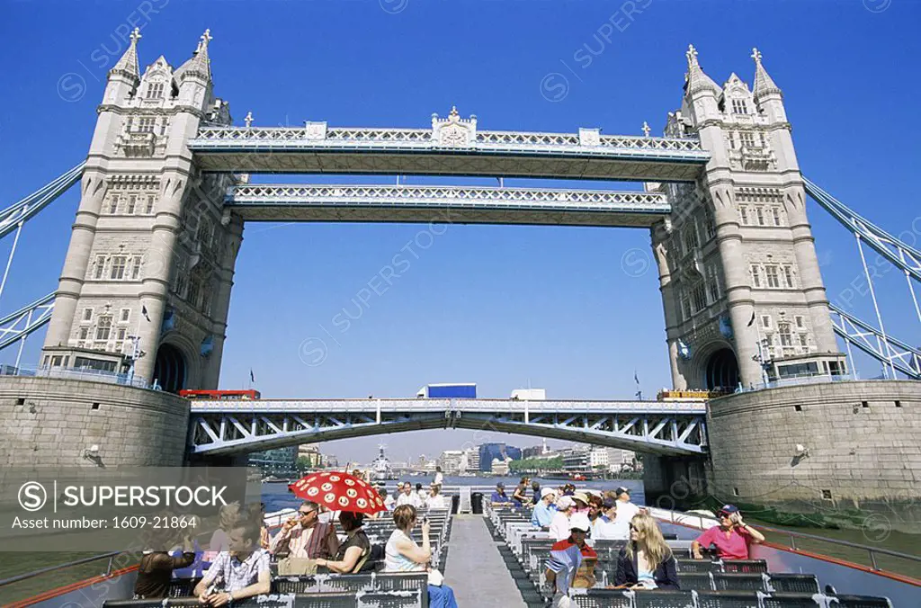 England,London,Tourist on Tour Boat Passing Under Tower Bridge