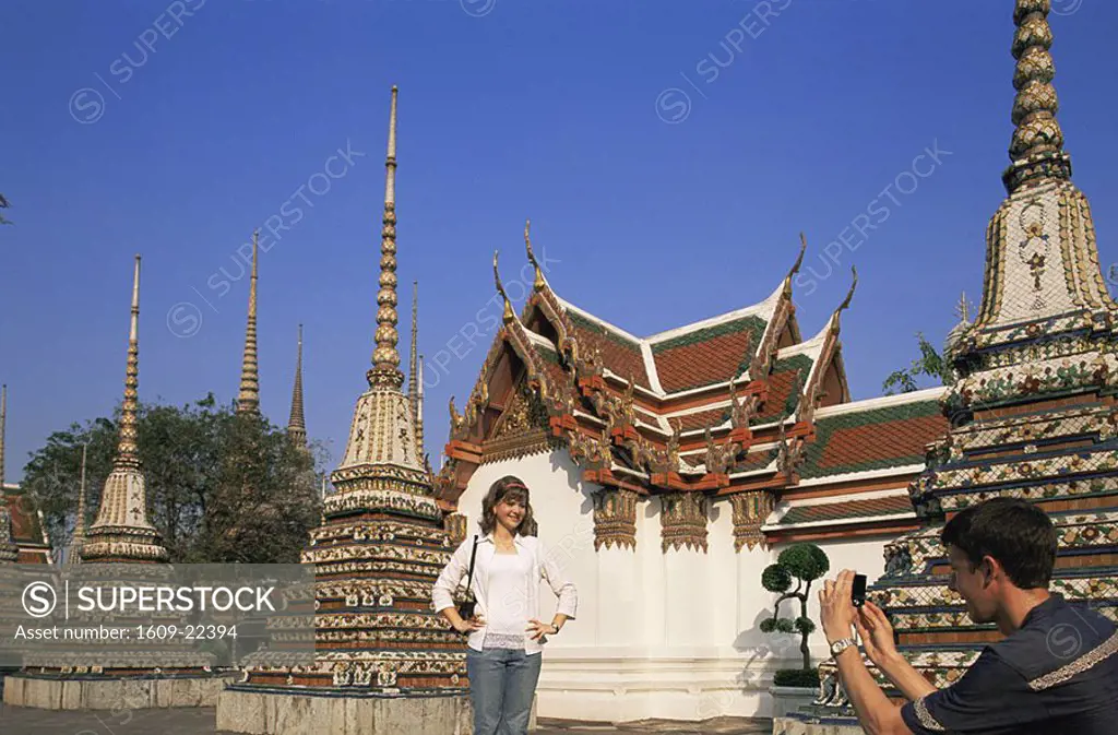 Thailand, Bangkok, Tourist Couple Taking Photos in Wat Po