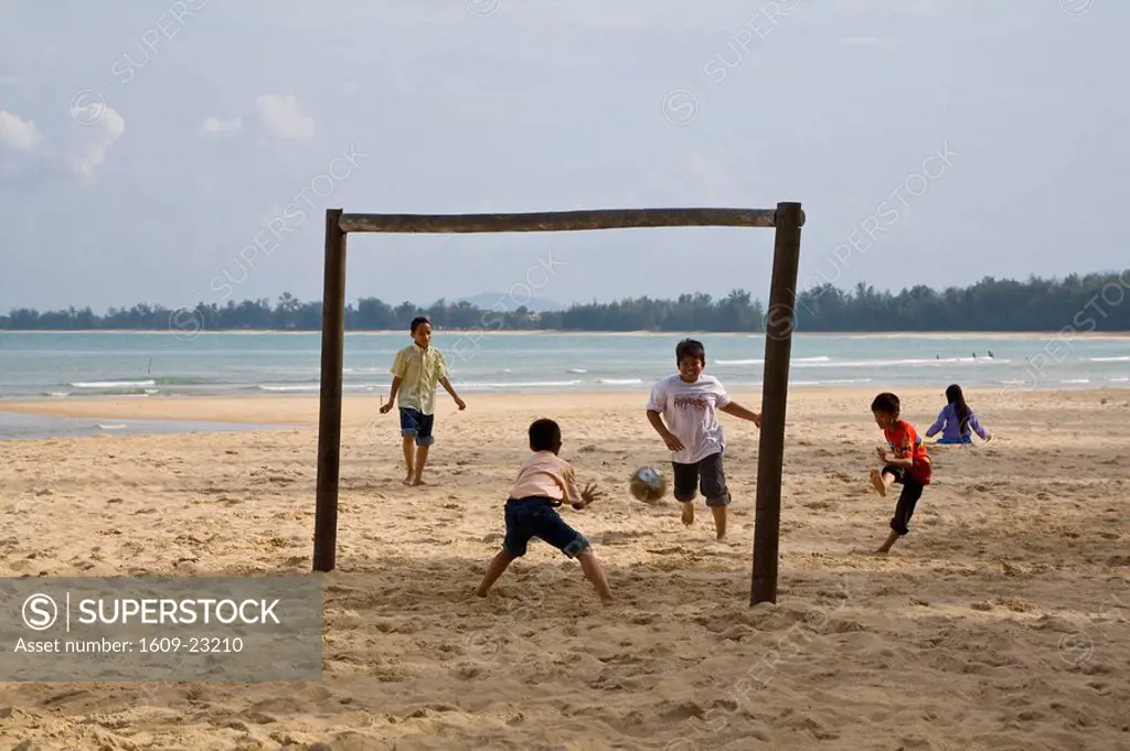 Boys playing beach football, Cherating, East Coast of Malaysia
