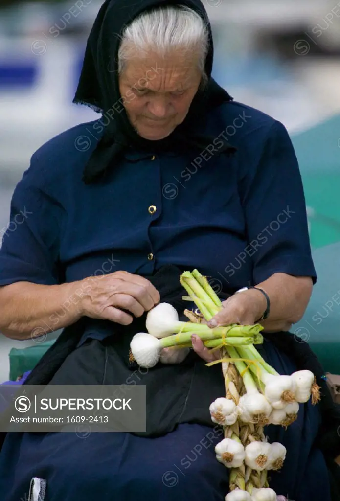 Woman selling garlic, Trogir, Croatia