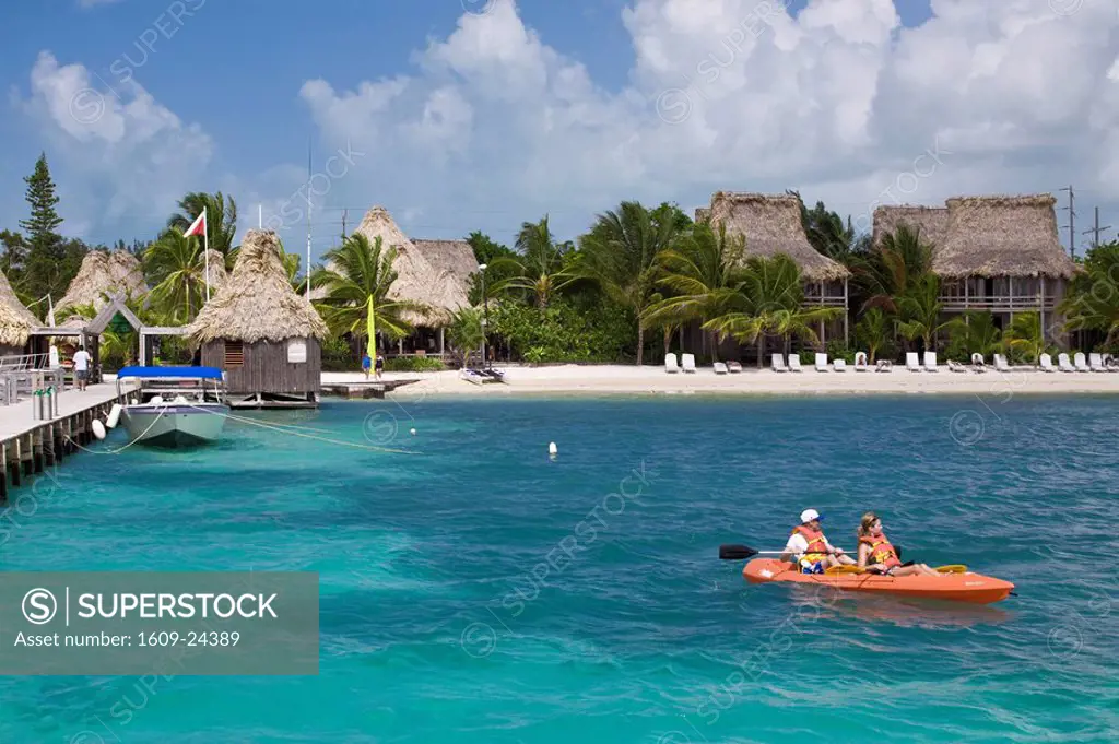 Belize, Ambergris Caye, San Pedro, Ramons Village Resort, Couple in sea kayak
