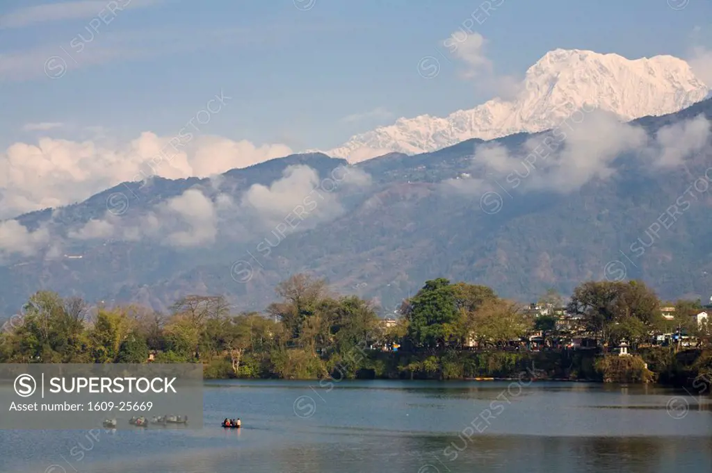 Nepal, Pokhara, Tourists in canoes on Phewa Lake & Annapurna range