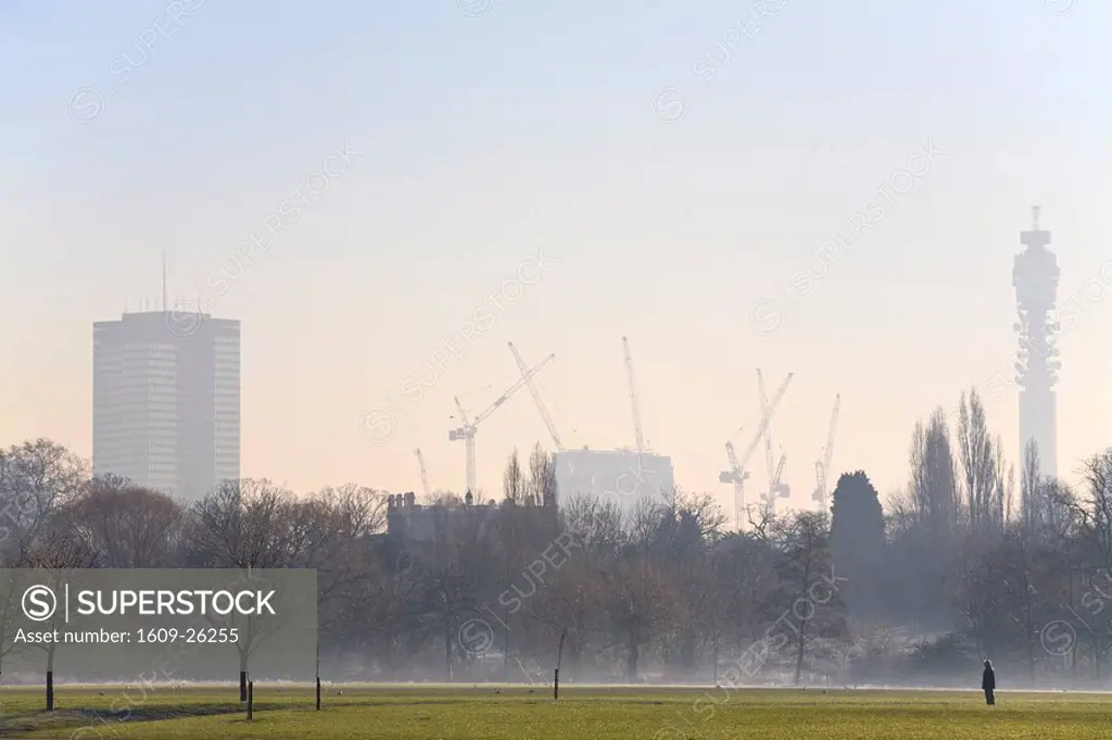 England, London, , Woman in Regents Park on a frosty morning with BT Tower in background