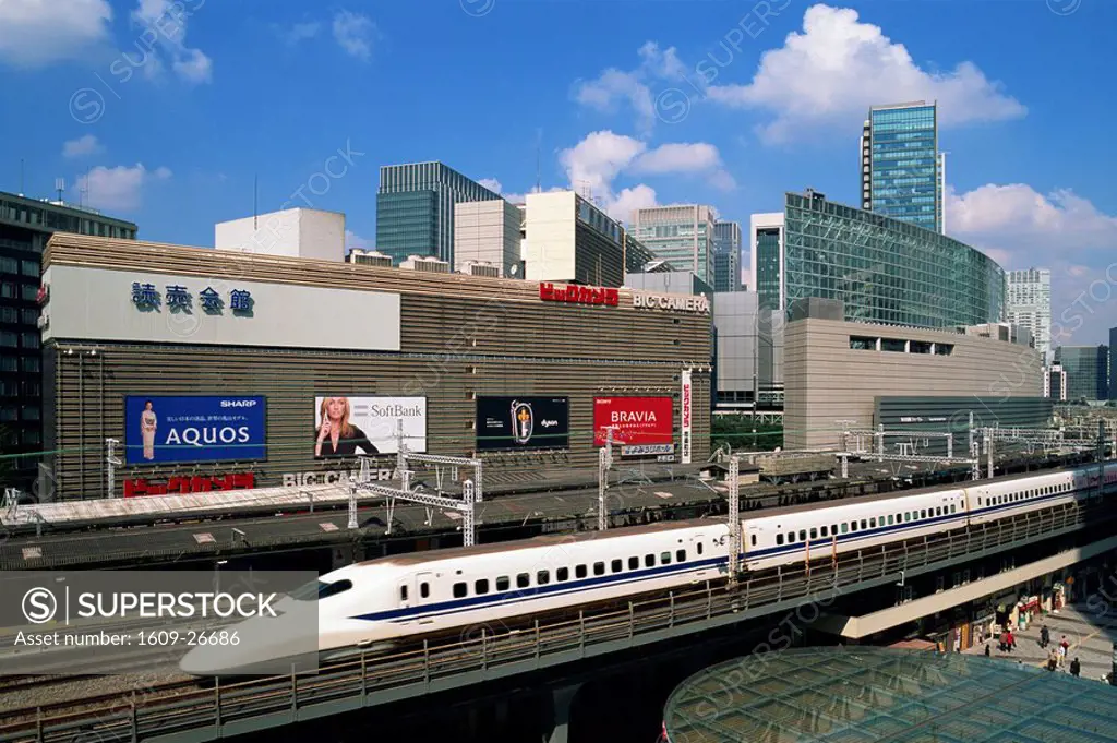 Japan, Honshu, Tokyo, Shinkansen Bullet Train and Marunouchi Business Area Skyline