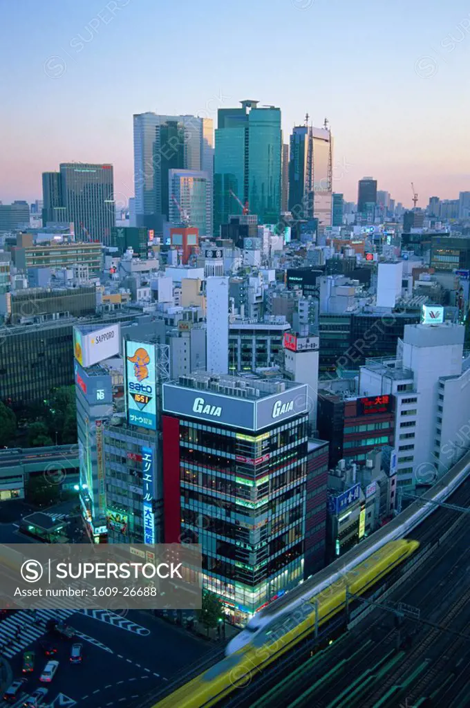 Japan, Honshu, Tokyo, Shinkansen Bullet Train and Hibiya Business Area Skyline