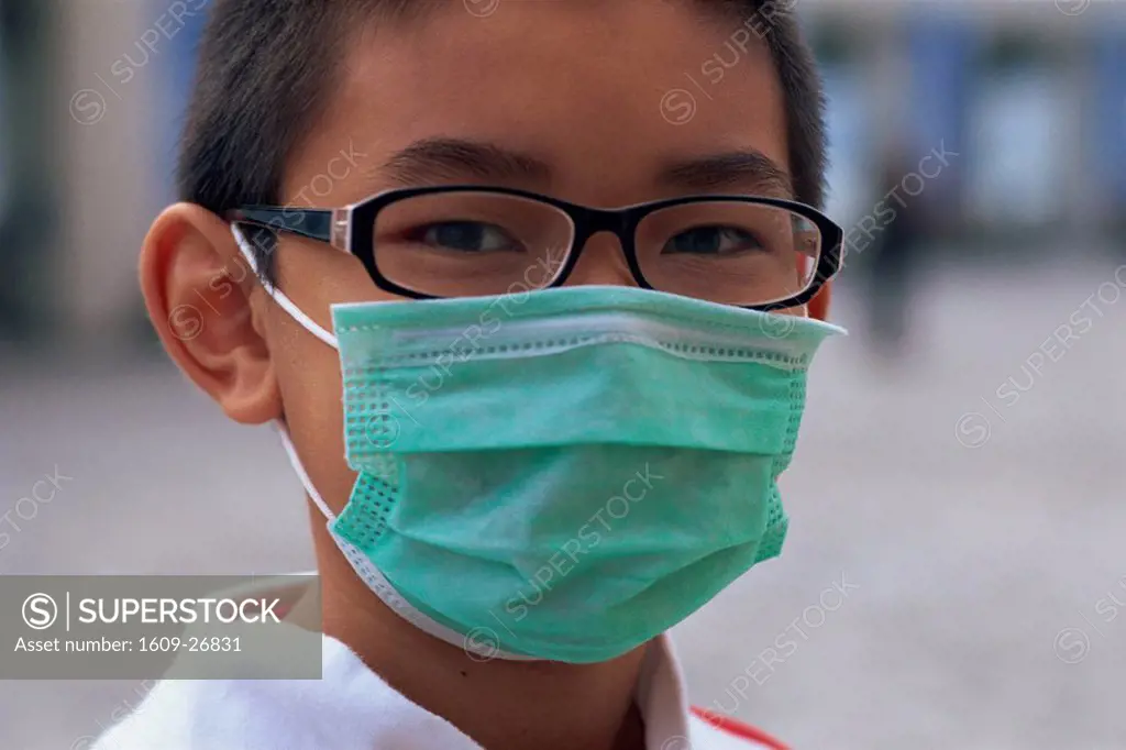 China, Hong Kong, Boy wearing cold mask