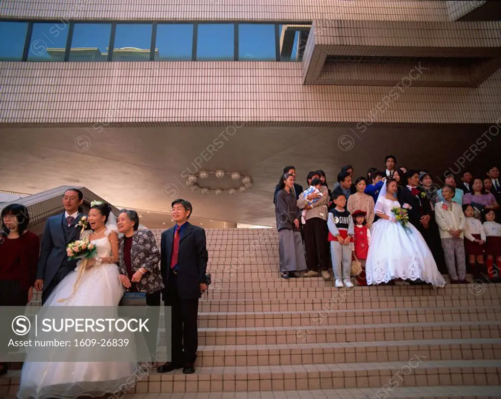 China, Hong Kong, Kowloon, Tsim Sha Tsui, Wedding Groups in front of the Hong Kong Cultural Centre