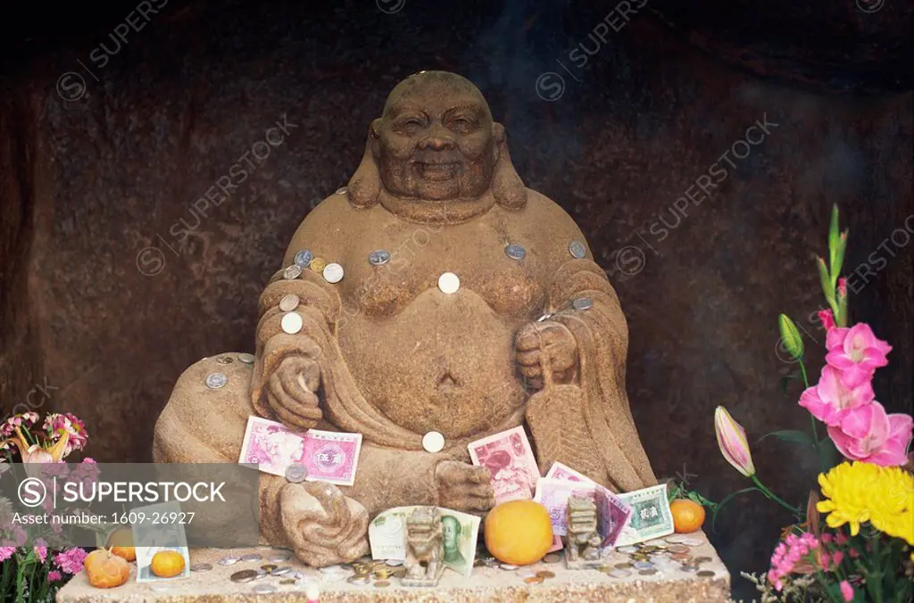 China, Macau, Buddha Statue and Offerings at A Ma Temple