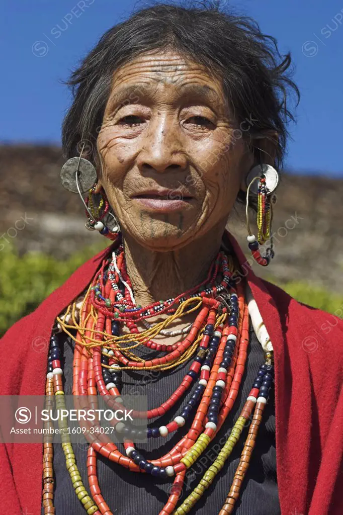 Myanmar Burma, Sagaing Region, Magyan Village, Naga Macham tribe lady with face tatoos