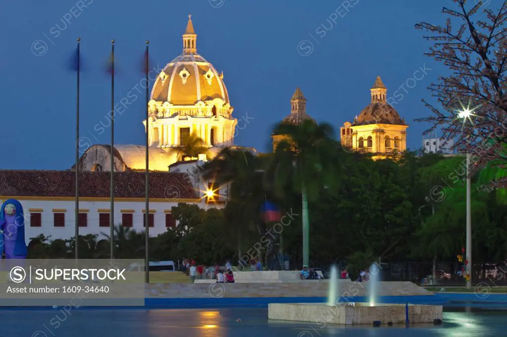 Colombia, Bolivar, Cartagena De Indias, Naval museum and Dome of San Pedro Claver Church reflected in Parque de la Marina