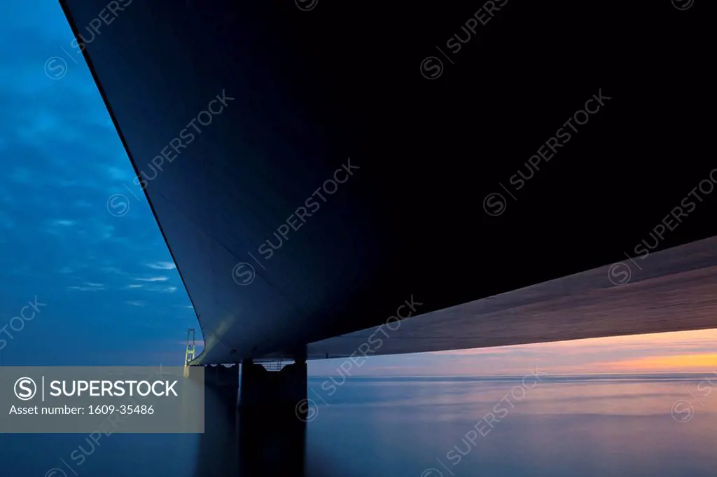 Dusk over the illuminated East Bridge as seen from Korsor, Denmark.