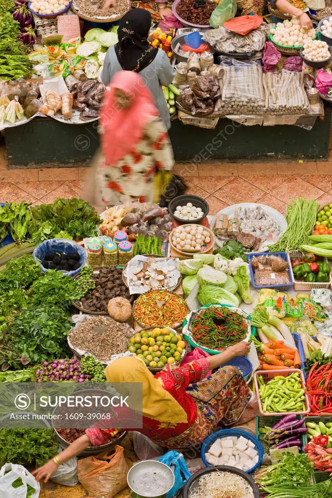 Malaysia, Kelantan State, Kota Bharu, central market, Woman selling fruit and vegetables