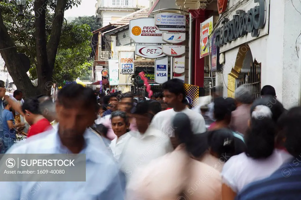 People walking along Dalada Vidiya Street, Kandy, Sri Lanka