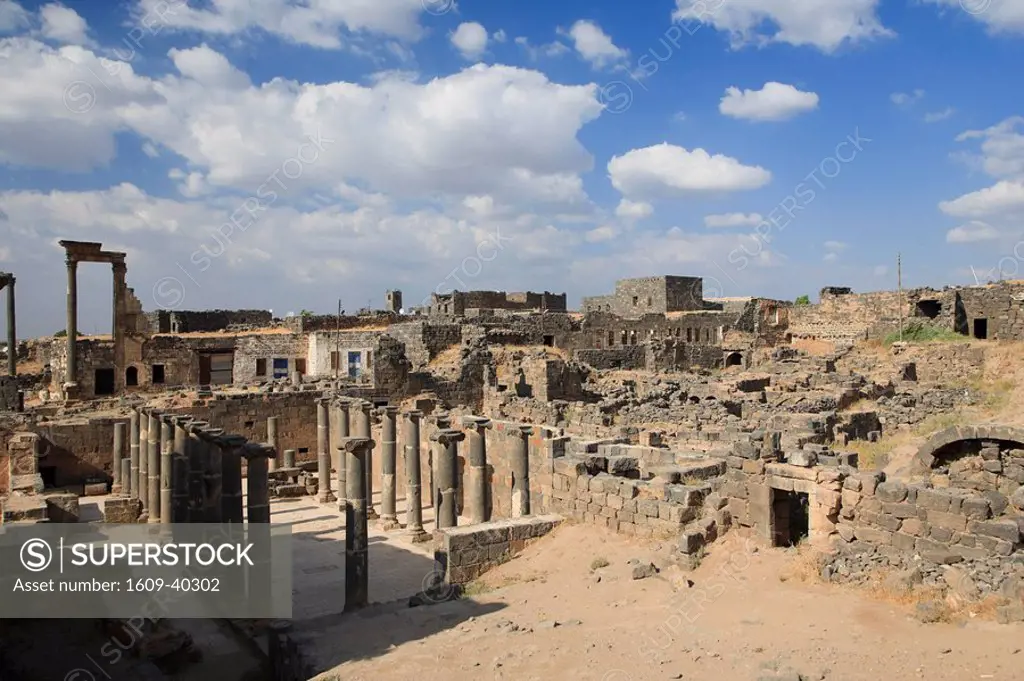 Syria, Bosra, ruins of the ancient Roman town a UNESCO site, ruins of Decumanus main east_west colonnaded street and Nymphaeum monumental fountain