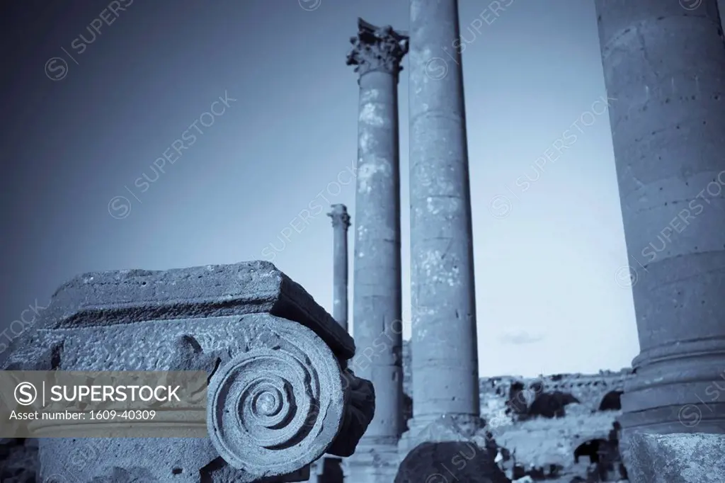 Syria, Bosra, ruins of the ancient Roman town a UNESCO site, ruins of Decumanus main east_west colonnaded street and Nymphaeum monumental fountain