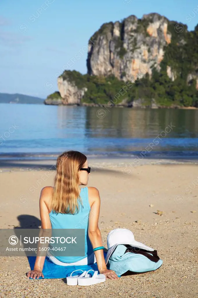Woman relaxing on Hat Rai Leh West beach, Railay, Krabi Province, Thailand MR