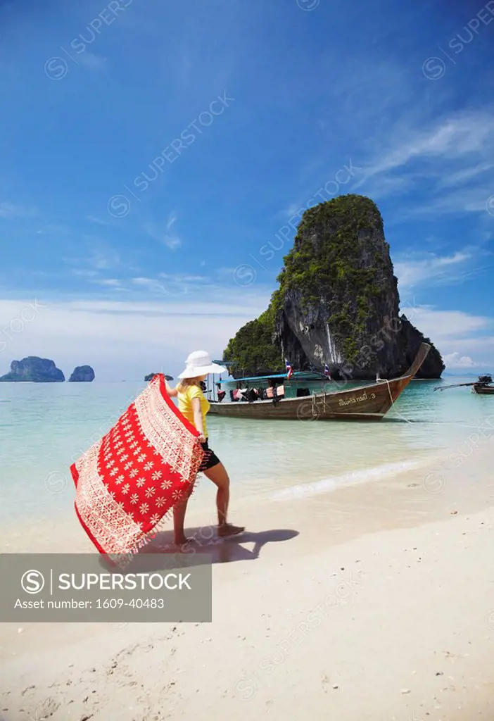 Woman walking on Hat Tham Phra Nang beach, Railay, Krabi Province, Thailand MR