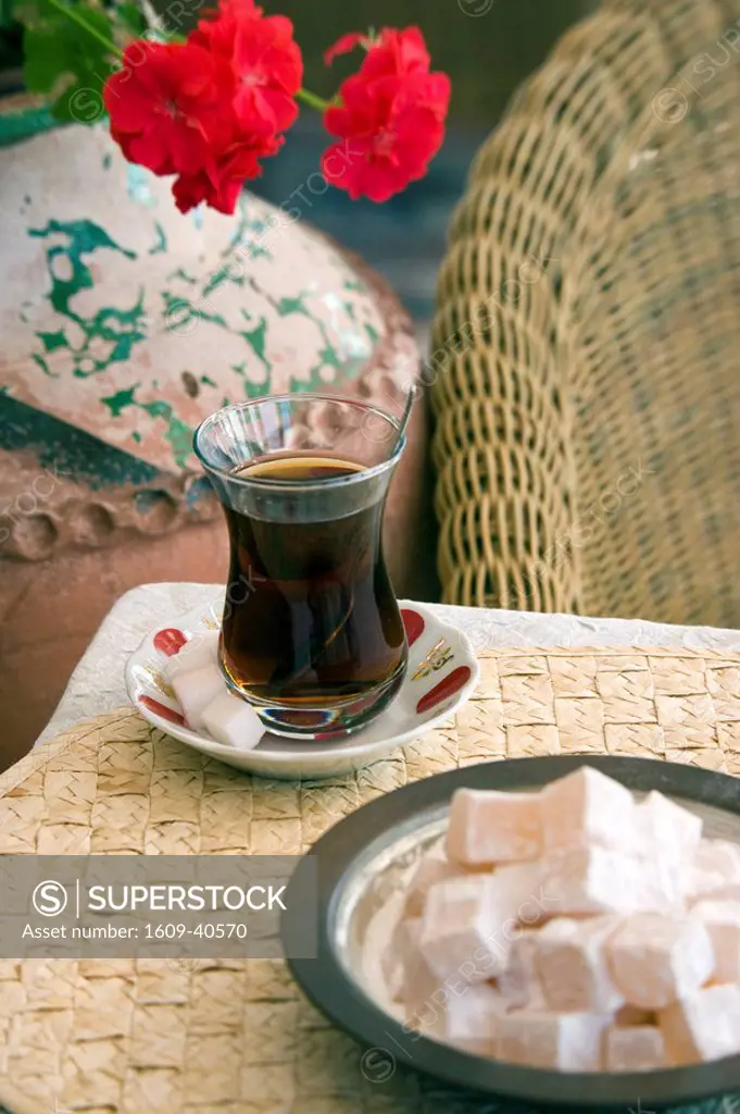 A glass of Turkish Tea and Bowl of Turkish Delight