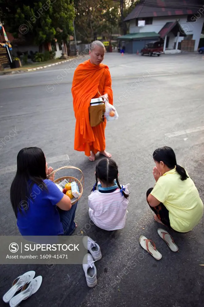 Thailand, Chiang Mai, Monks Receiving Offerings of Food