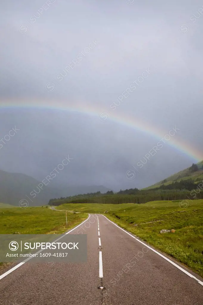 Scotland, Highland Region, Empty Road and Rainbow